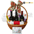 Triple Delight Gift Assortment gift featuring wine, chocolates, gourmet snacks and nuts